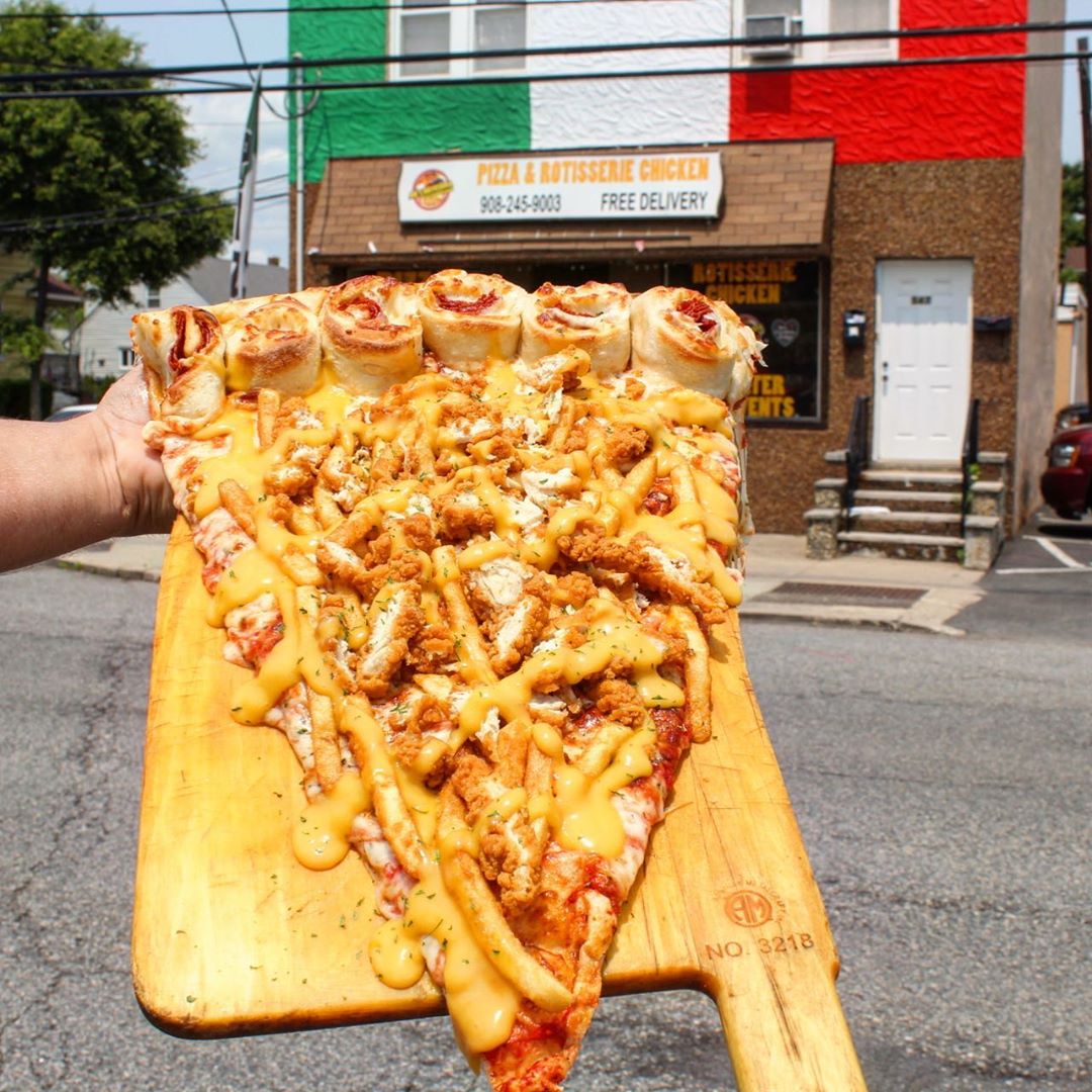  Joe' Rotisseria pizza gigante |  nueva tendencia gastronómica es una porción de pizza gigante: la más grande que hayas visto |  Su belleza